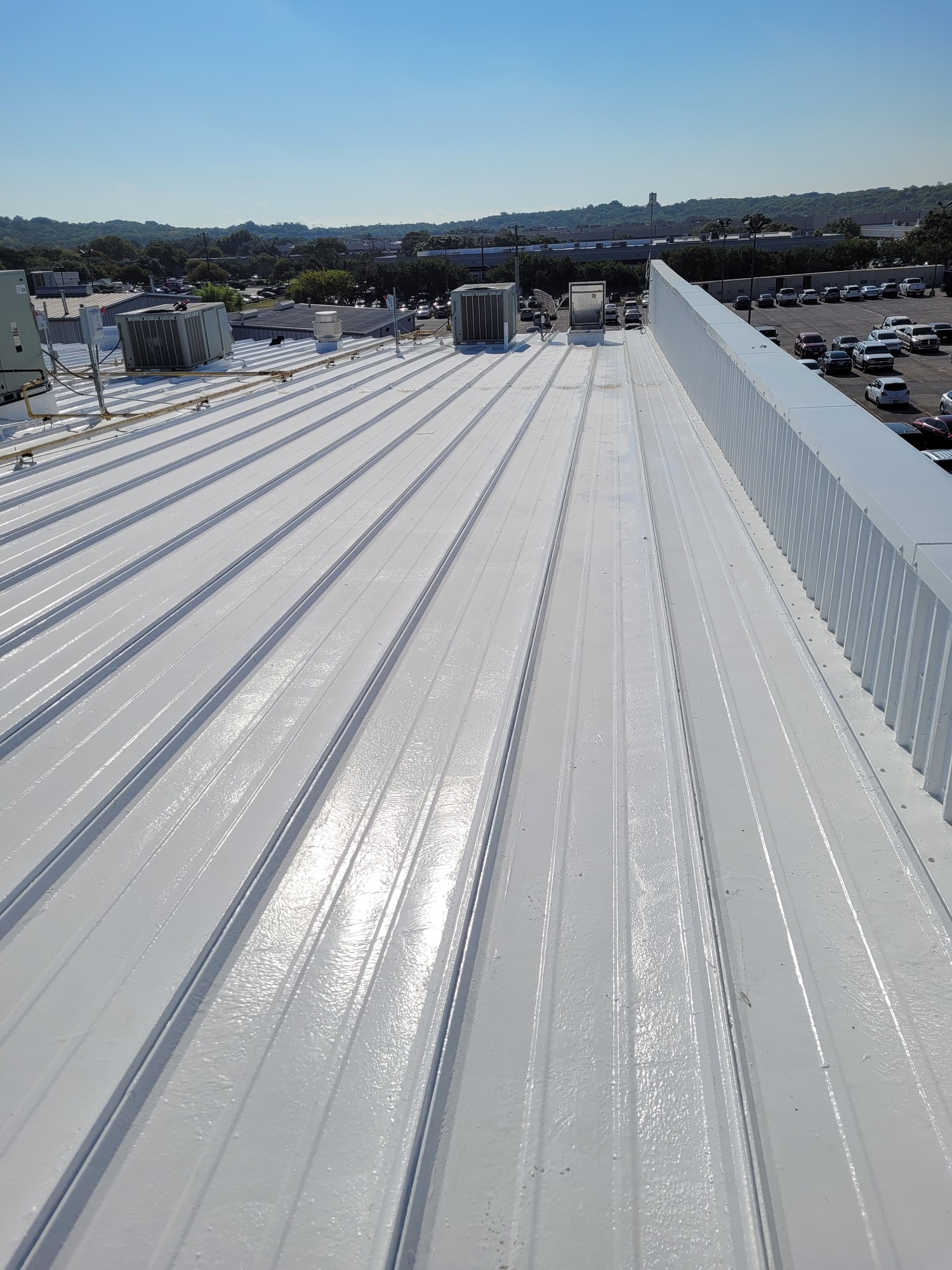 Coated standing-seam roof
