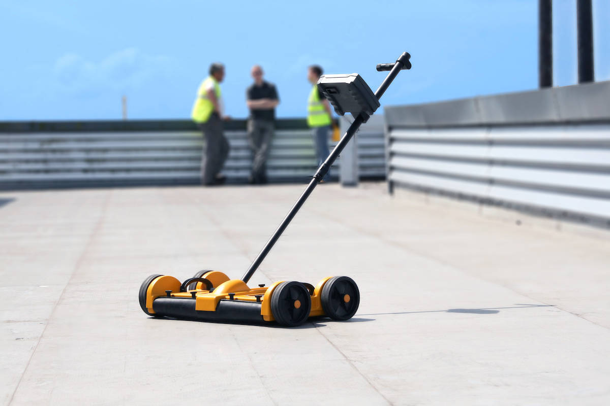 Tramex Dec Scanner on a commercial flat roof